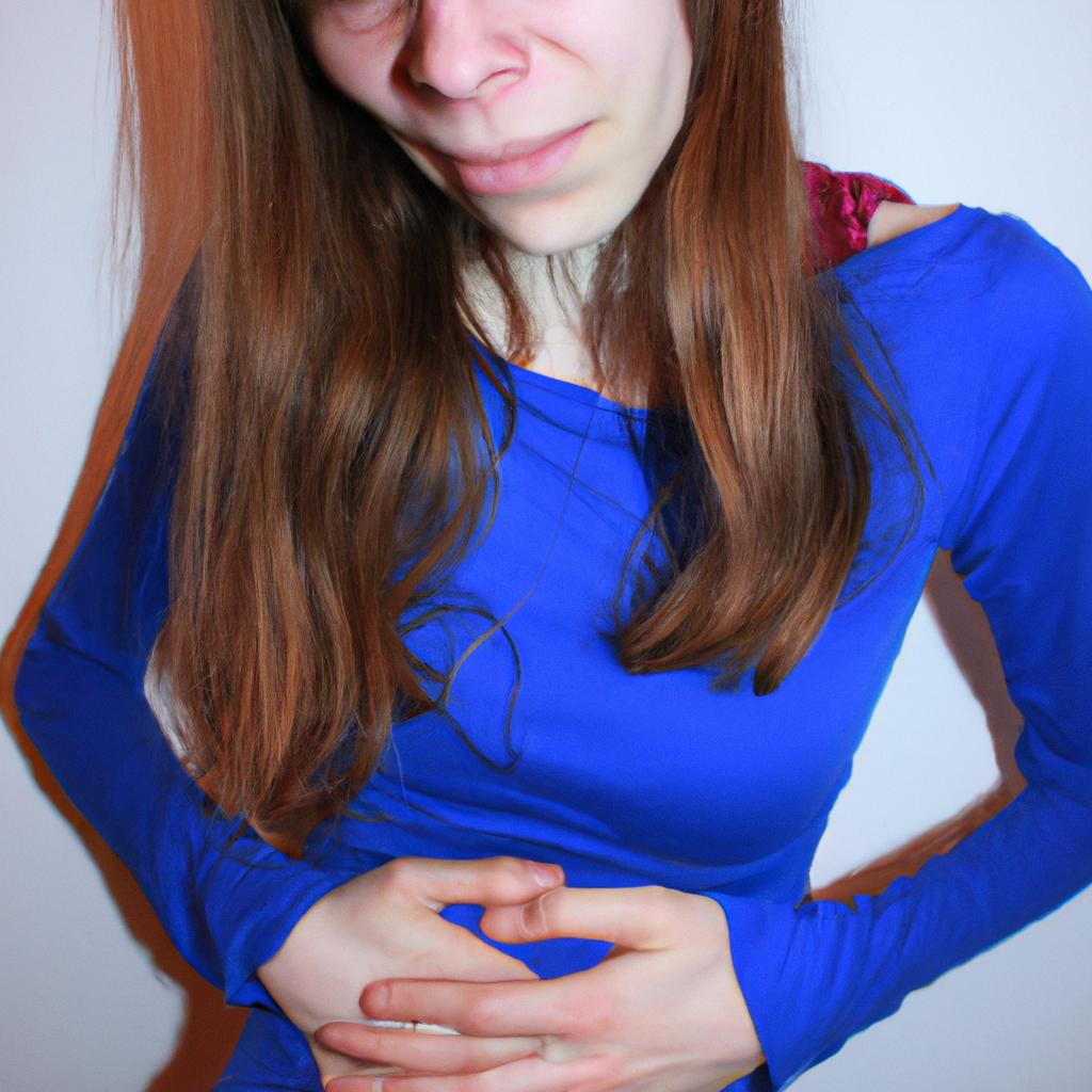 Person holding their stomach, grimacing